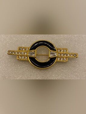 Monet Gold-Tone Black Enamel Circular Brooch with Crystal Accents